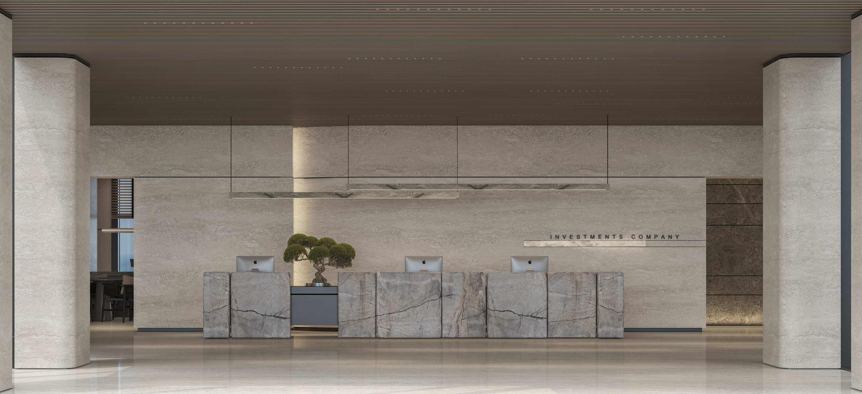 Sculptural stone reception desk against a limestone wall